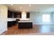 Beautiful kitchen featuring dark cabinets, white countertops, island, stainless steel appliances, and recessed lighting at 8105 Milender Blvd, Indianapolis, IN 46237