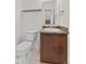 Cozy half bathroom features a vanity with a sink and a toilet for guests at 8547 S Tibbs Ave, Indianapolis, IN 46217