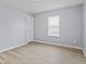 Inviting bedroom with natural light and hardwood flooring at 8547 S Tibbs Ave, Indianapolis, IN 46217