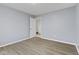 Bright bedroom with hardwood flooring and light-colored walls at 8547 S Tibbs Ave, Indianapolis, IN 46217