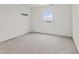 Spacious bedroom with natural light filtering through the window at 8547 S Tibbs Ave, Indianapolis, IN 46217