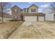 Inviting two-story home with brick and siding, a well-manicured lawn, and a convenient two-car garage at 8547 S Tibbs Ave, Indianapolis, IN 46217