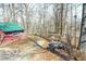 A view of the backyard with a garage or shed with trees in the background at 9464 N State Rd 135, Morgantown, IN 46160