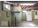 Spacious basement area with painted walls, utility connections and storage space at 9464 N State Rd 135, Morgantown, IN 46160