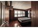 Bedroom featuring natural light, wood walls and space for a bed at 9464 N State Rd 135, Morgantown, IN 46160