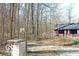 Charming one-story home featuring white trim and wooded surroundings at 9464 N State Rd 135, Morgantown, IN 46160