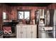 Galley kitchen features stainless steel appliances, white cabinets and view to outside at 9464 N State Rd 135, Morgantown, IN 46160
