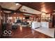 Bright open-concept living area with wood floors, fireplace, and a hutch, perfect for entertaining at 9464 N State Rd 135, Morgantown, IN 46160