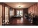 Living area featuring wood walls and lots of natural light at 9464 N State Rd 135, Morgantown, IN 46160