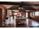 Cozy living space with an open floor plan, stainless steel appliances, and wooden accents for a warm, inviting ambiance at 9464 N State Rd 135, Morgantown, IN 46160