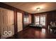 Living area featuring wood walls and access to outdoor area at 9464 N State Rd 135, Morgantown, IN 46160
