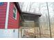 A cozy, screened porch brings comfort and relaxation to this delightful home in a nature setting at 9464 N State Rd 135, Morgantown, IN 46160