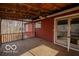 View of the wooden covered back porch at 9464 N State Rd 135, Morgantown, IN 46160