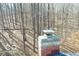 Close up photo showing a chimney on the roof with wooded area in the background at 9464 N State Rd 135, Morgantown, IN 46160