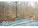 A view of a roof with trees in the background at 9464 N State Rd 135, Morgantown, IN 46160