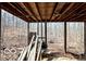 View under deck with exposed beam ceiling, wooden supports and view of the woods at 9464 N State Rd 135, Morgantown, IN 46160