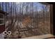 Scenic view of the wooded landscape from the home's interior at 9464 N State Rd 135, Morgantown, IN 46160