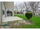 Home exterior featuring a sliding glass door, patio, and lawn at 9685 Glowing Flame Dr, Fishers, IN 46037