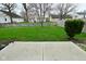 Landscaped backyard featuring a patio and lawn at 9685 Glowing Flame Dr, Fishers, IN 46037