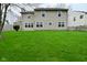 Home exterior with a large backyard lawn and fence at 9685 Glowing Flame Dr, Fishers, IN 46037
