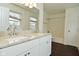 Bathroom featuring a double sink vanity with granite countertops and white cabinets at 9685 Glowing Flame Dr, Fishers, IN 46037
