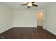 Bright bedroom featuring laminate floors and a ceiling fan at 9685 Glowing Flame Dr, Fishers, IN 46037