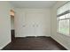 Bedroom featuring dark wood floors, natural light, and ample closet space at 9685 Glowing Flame Dr, Fishers, IN 46037