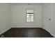 Bedroom with dark wood flooring, and natural light; access to door at 9685 Glowing Flame Dr, Fishers, IN 46037