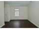 This bedroom features hardwood floors, a window, and a closet door at 9685 Glowing Flame Dr, Fishers, IN 46037