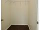 Walk-in closet with white walls, dark laminate floors and wire shelving at 9685 Glowing Flame Dr, Fishers, IN 46037