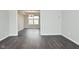Bright dining room with hardwood floors, neutral paint, and a modern chandelier at 9685 Glowing Flame Dr, Fishers, IN 46037