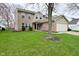 Charming two-story home with brick and vinyl facade, complemented by a well-maintained lawn and mature trees in the front yard at 9685 Glowing Flame Dr, Fishers, IN 46037