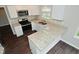 Modern kitchen features white cabinets, granite countertops, and stainless appliances at 9685 Glowing Flame Dr, Fishers, IN 46037