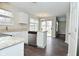 Bright kitchen featuring white cabinets, stainless steel appliances, and an adjacent dining area at 9685 Glowing Flame Dr, Fishers, IN 46037