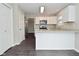 Spacious kitchen with breakfast bar, white cabinets, and stainless steel appliances at 9685 Glowing Flame Dr, Fishers, IN 46037