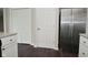 Kitchen with stainless steel refrigerator and view of the pantry and closet at 9685 Glowing Flame Dr, Fishers, IN 46037