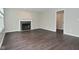 Living room featuring a fireplace with decorative mantel and tile surround at 9685 Glowing Flame Dr, Fishers, IN 46037