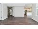 Bright living room showcasing hardwood floors with an open floor plan into the kitchen at 9685 Glowing Flame Dr, Fishers, IN 46037