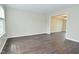 Bright living room features hardwood floors, neutral paint, and access to the dining room at 9685 Glowing Flame Dr, Fishers, IN 46037