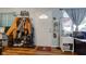 Inviting entryway with hardwood floors, coat rack, storage, and natural light from the window at 115 N Spring St, Greenfield, IN 46140
