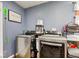 Modern washer and dryer set in a well-organized laundry room with ample storage space at 115 N Spring St, Greenfield, IN 46140