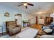 Spacious living room with an armchair, couch, and views to the kitchen and a side room at 115 N Spring St, Greenfield, IN 46140
