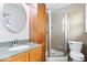 Bathroom featuring tiled walls, a shower stall, and a granite countertop sink at 1313 Oakwood Trl, Indianapolis, IN 46260