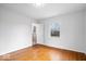 Bedroom featuring hardwood floors with an ensuite bathroom at 1313 Oakwood Trl, Indianapolis, IN 46260