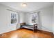 Well-lit bedroom with hardwood floors and natural light at 1313 Oakwood Trl, Indianapolis, IN 46260
