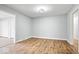 Cozy living room featuring hardwood floors and neutral walls at 1313 Oakwood Trl, Indianapolis, IN 46260