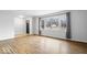 Bright living room featuring hardwood floors and a large window at 1313 Oakwood Trl, Indianapolis, IN 46260