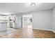 Open living area with hardwood flooring connects the kitchen and living spaces at 1313 Oakwood Trl, Indianapolis, IN 46260