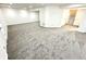 Wide shot of carpeted basement with white walls and trim near a stairwell at 14596 Toponas Pl, Fishers, IN 46040