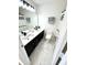 Modern bathroom featuring dual sinks, marble tile floors, and a black and white shower curtain at 14596 Toponas Pl, Fishers, IN 46040